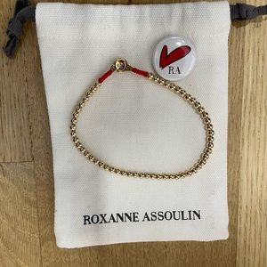 Roxanne Assoulin anklet, gold bubbles with red trim. Never worn. With bag.